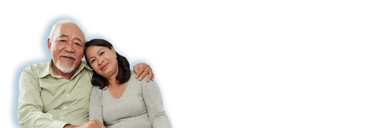 Senior couple living at home with the help of a caregiver